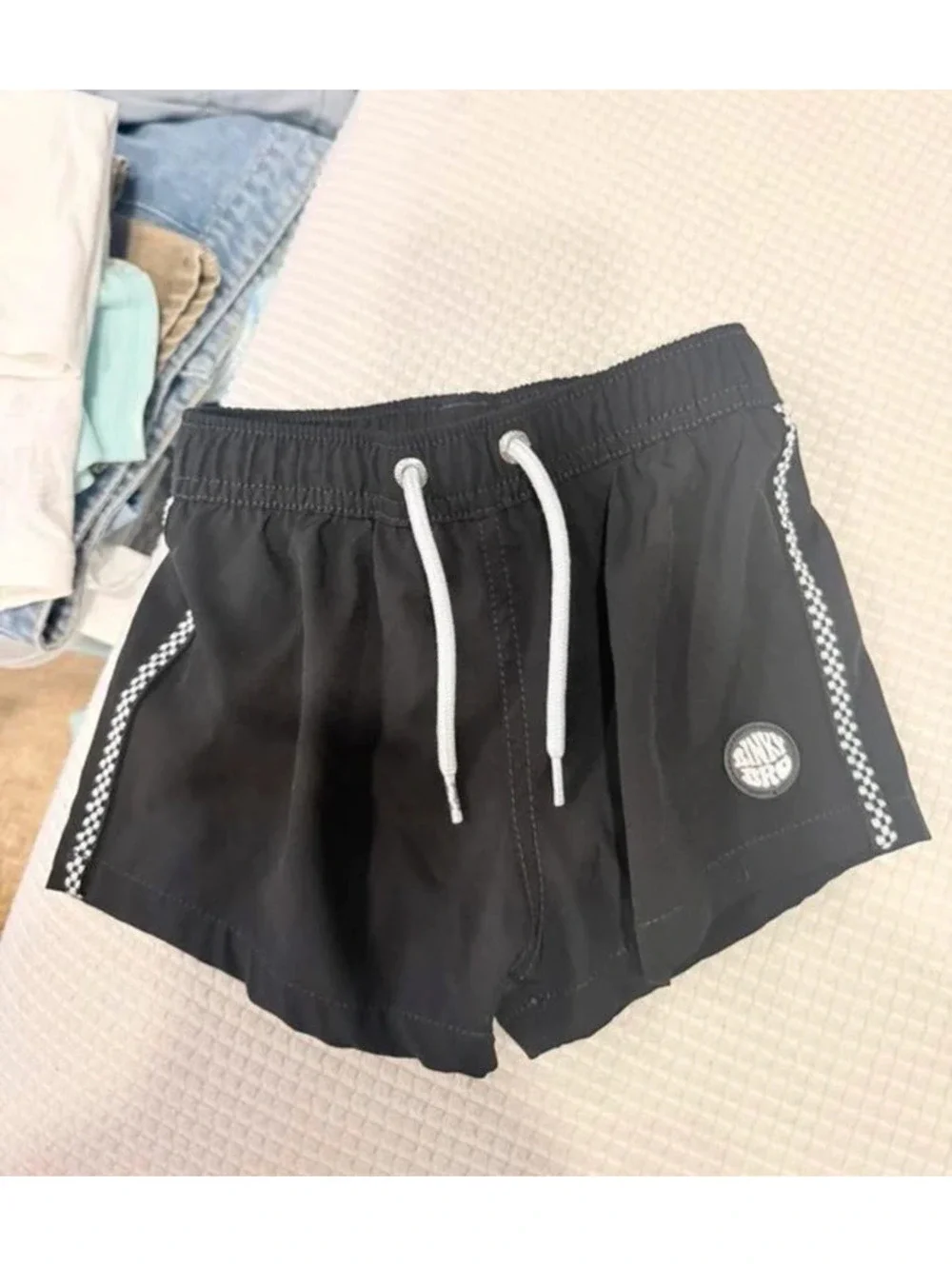 Binky bro black checkered toddler swim trunks